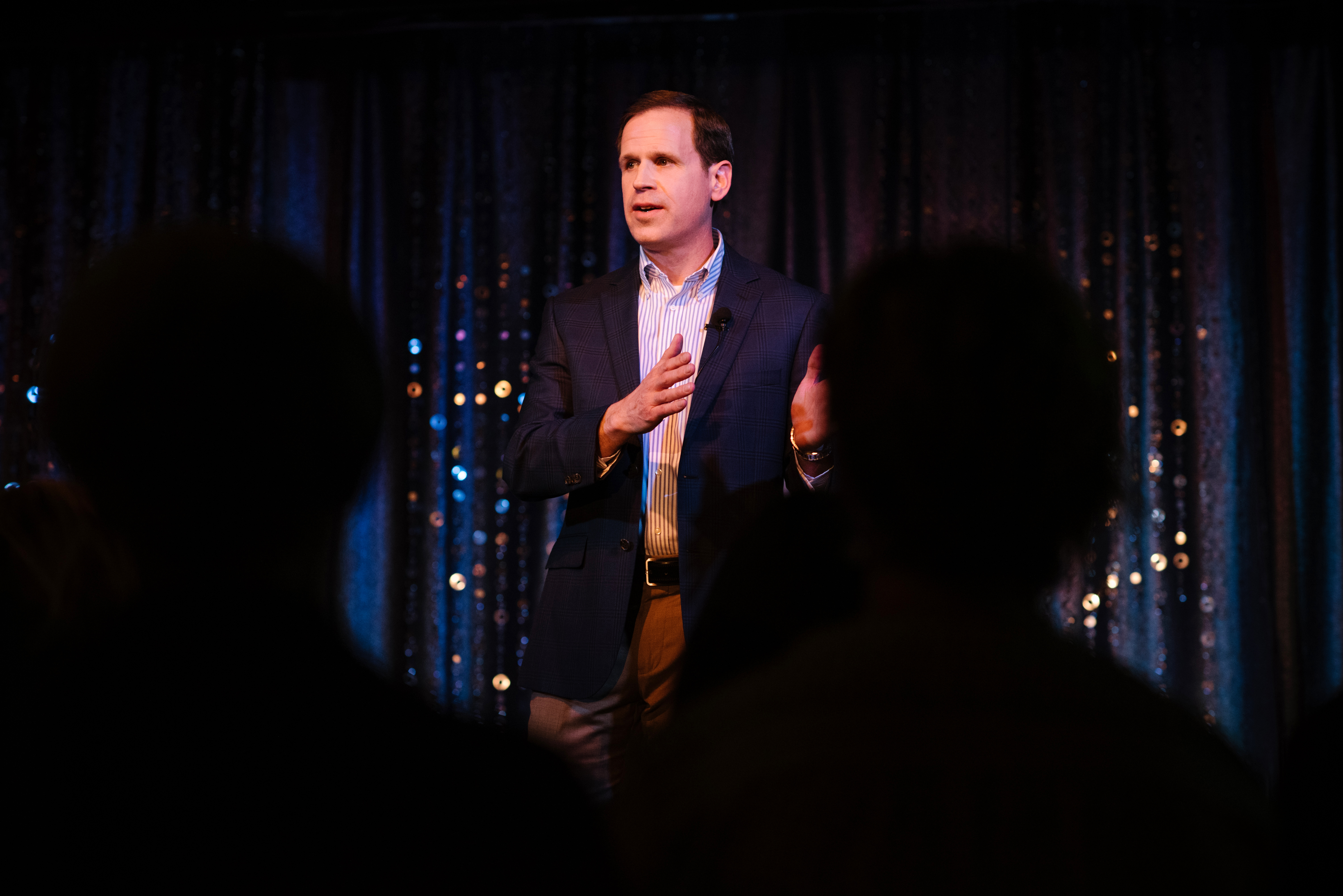 Man-Giving-Speech-at-Conference healthcare motivational speaker