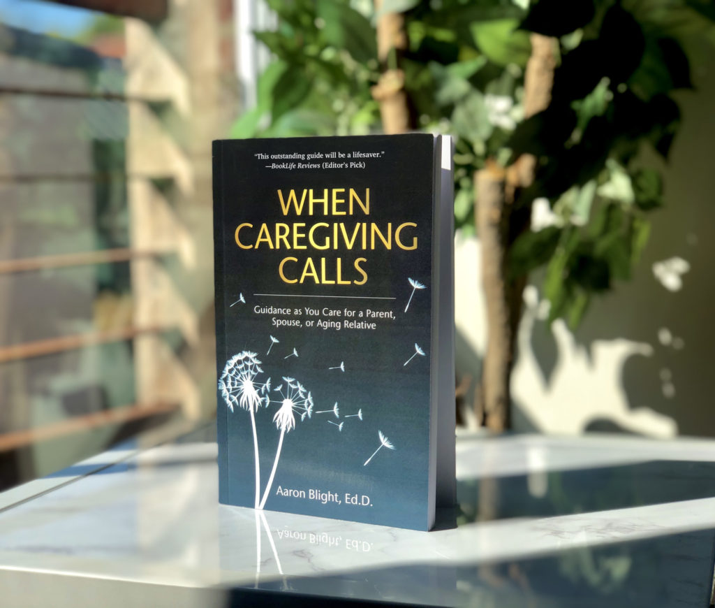 When Caregiving Calls books on a table