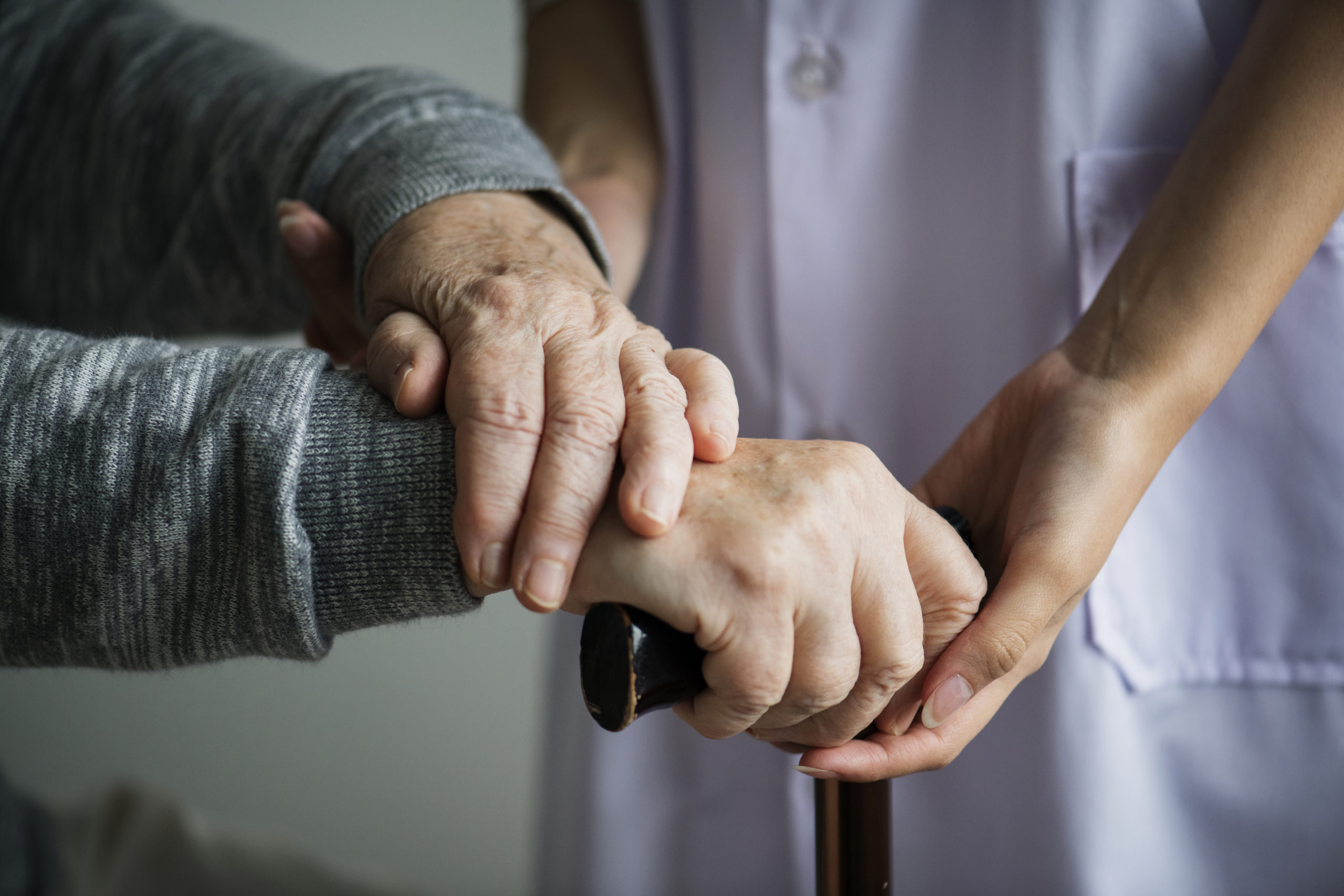caregivers holding hands