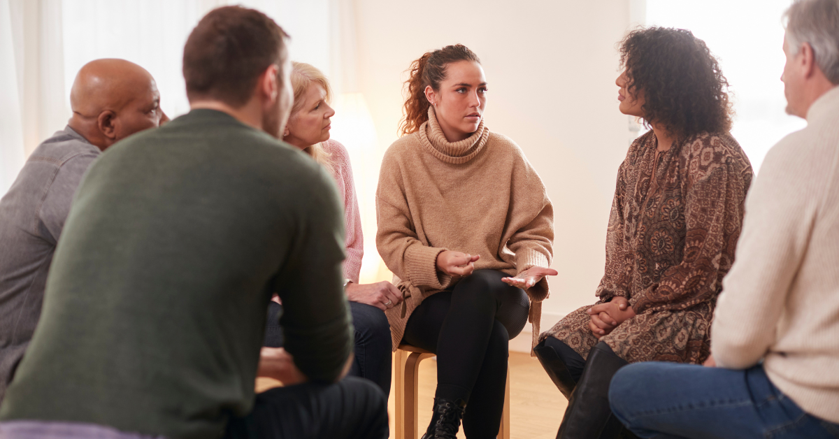 group of caregivers speaking together at a support group session