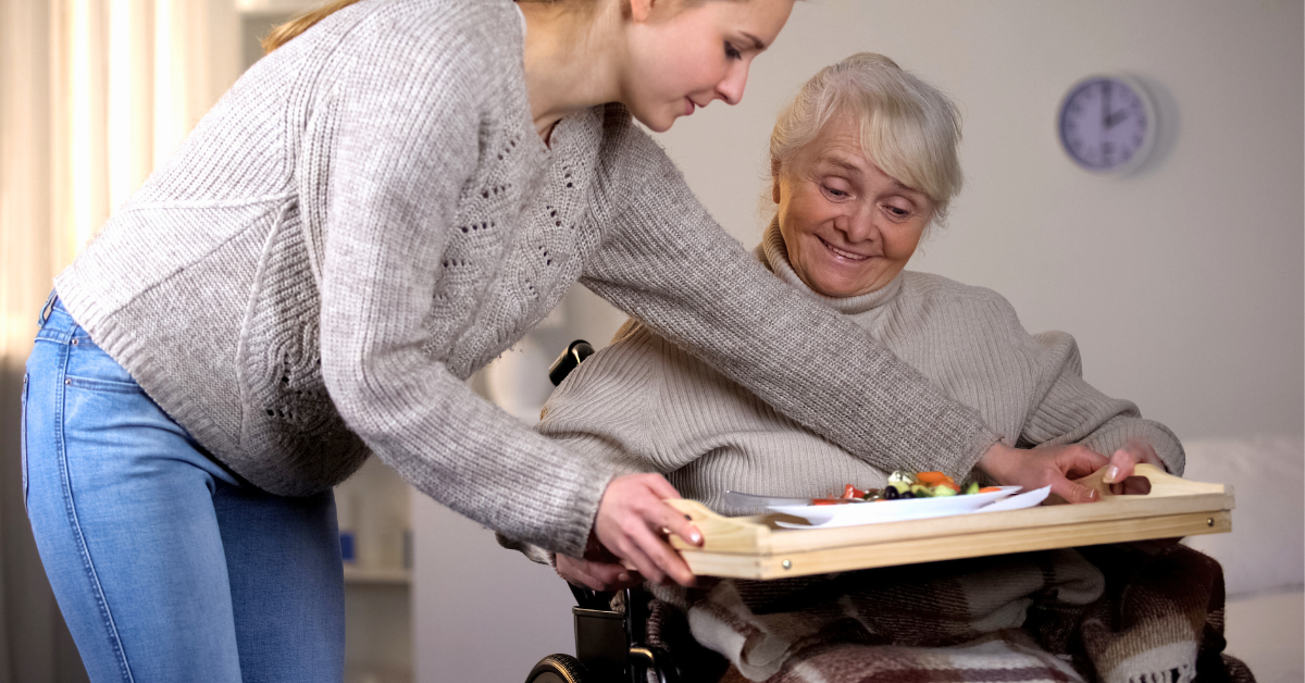 late twenties woman providing elder care to her aging mother